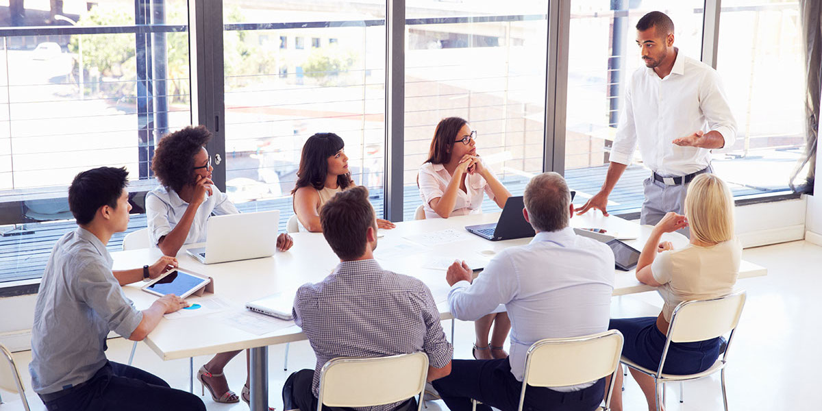 Businessmen sitting at a table discusing