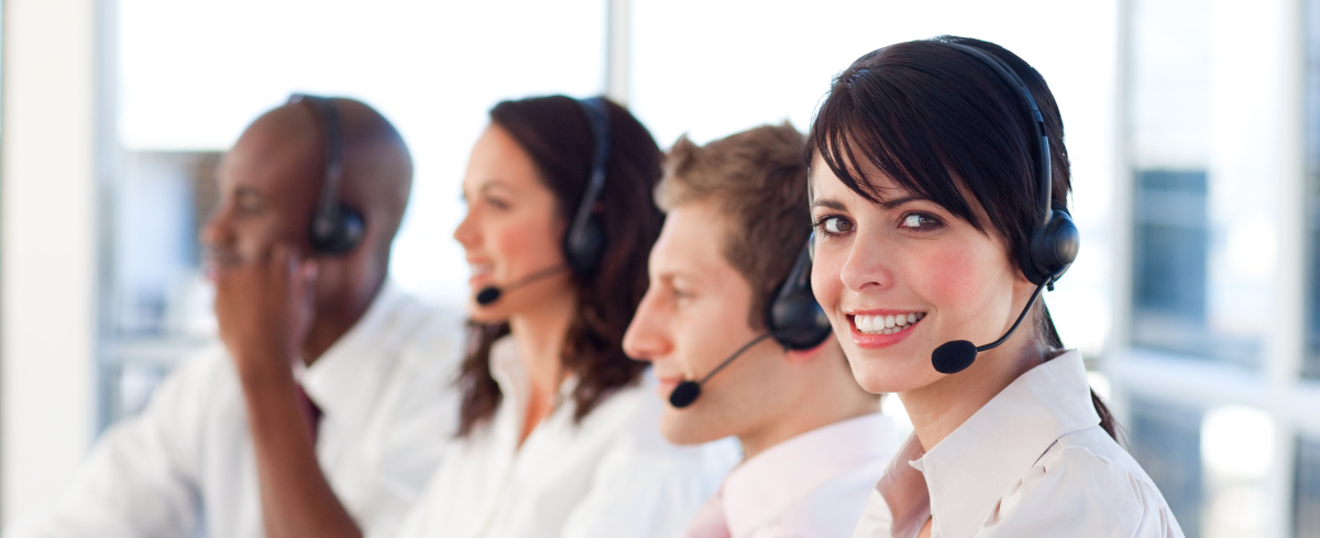 Employees using headsets to communicate with customers