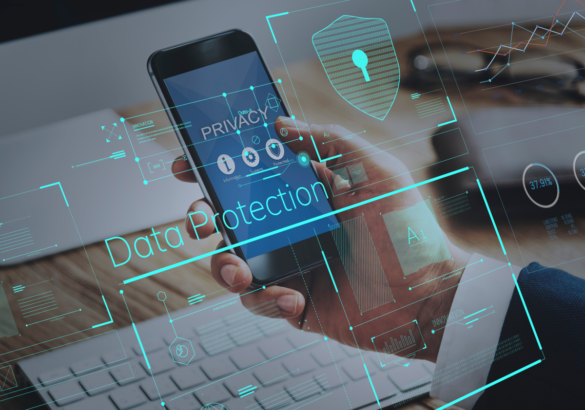 Man holding mobile phone with data protection words on it