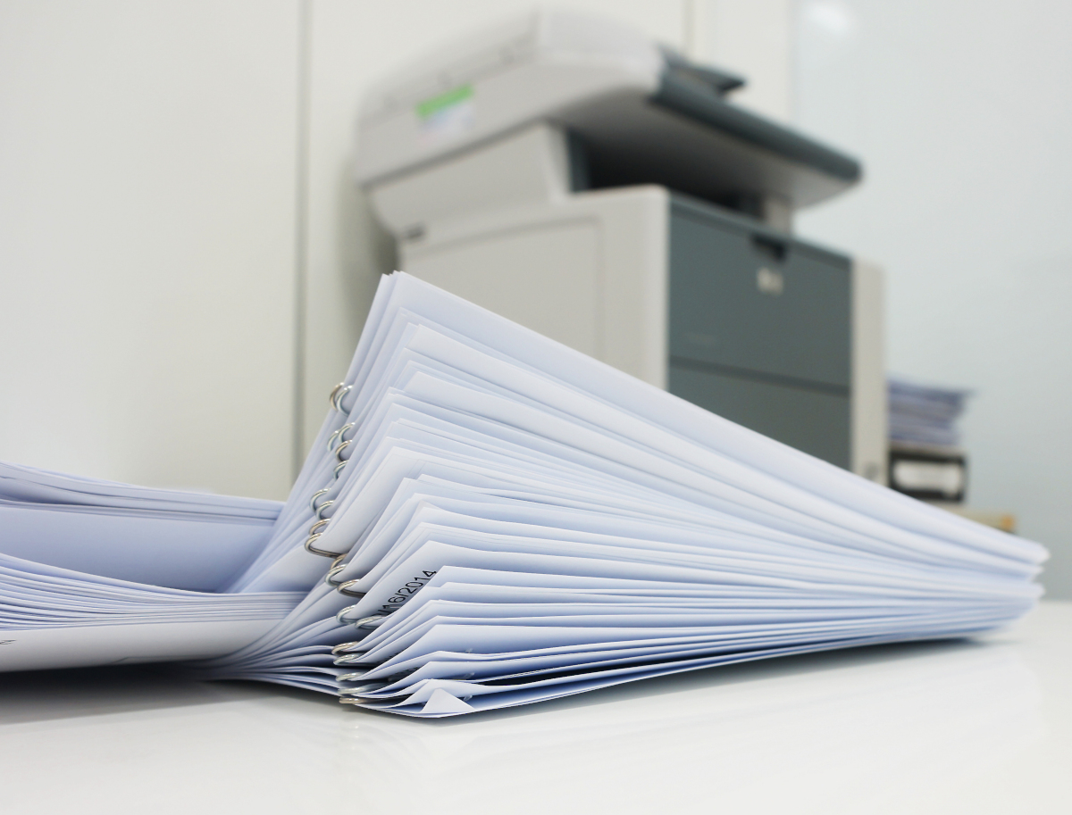 Mulitple stacks of papers held together with paper clips