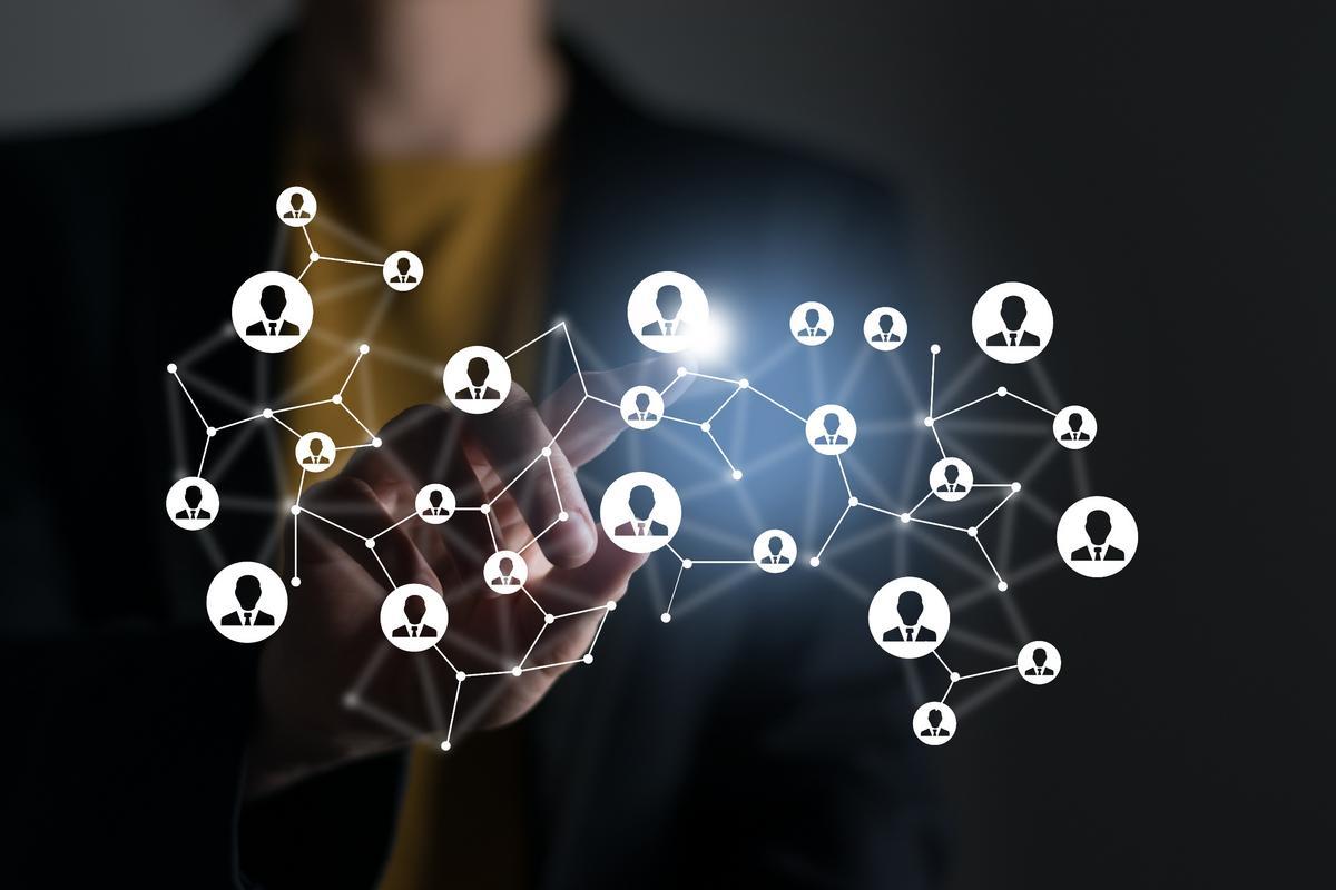 Woman pointing at digital user icons