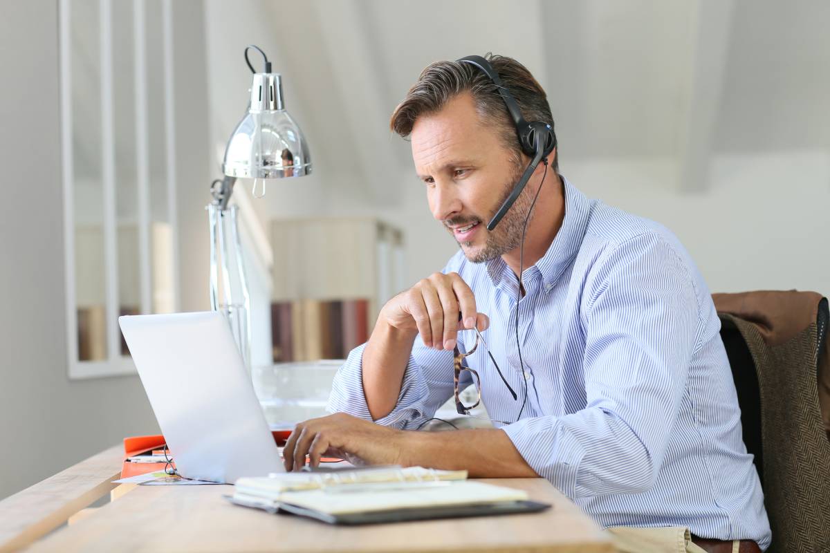 Man with headphones using laptop
